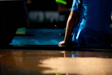 children swimming in pool at schoolの写真素材