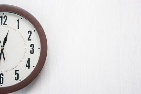 old clock  on white wood backgroundの写真素材