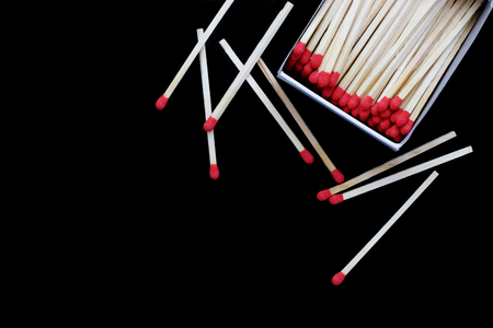 open Matchbox isolated on black backgroundの写真素材