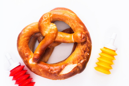 Homemade twisted knot Soft salt Pretzels on white backgroundの写真素材
