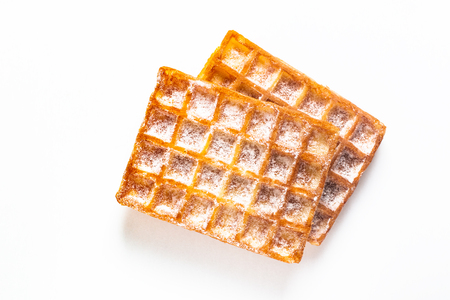 Food concept Classic square Waffles with icing sugat toping on white backgroundの写真素材