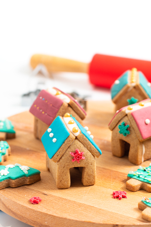 Holiday food DIY pastel Christmas Cookies, Gingerbread Houses, and Christmas tree for gift or partyの写真素材