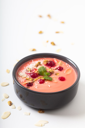 Healthy food by color of 2019 Yogurt Breakfast Bowl  with coconut, almond, flax seeds, Granola, and red currants in ceramic bowl with copy spaceの写真素材
