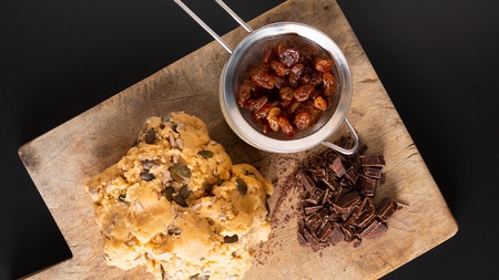 Healthy food concept Homemade raw dough of Trail Mix organic Whole grains Energy cookies on wooden board with copy spaceの写真素材