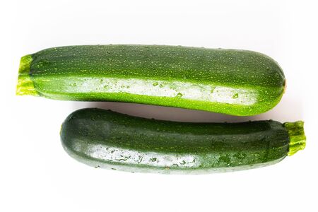 Healthy food concept organic green Zucchini or courgette isolated on white backgroundの写真素材