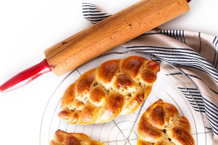 Homemade food concept fresh baked bread braid challah dough on white background with copy spaceの写真素材