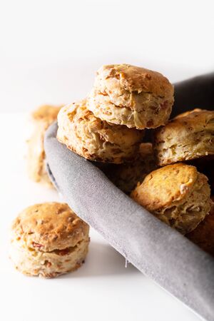 Food concept Fresh baked Homemade buttery, salty Ham and cheese scones on white backgroundの写真素材