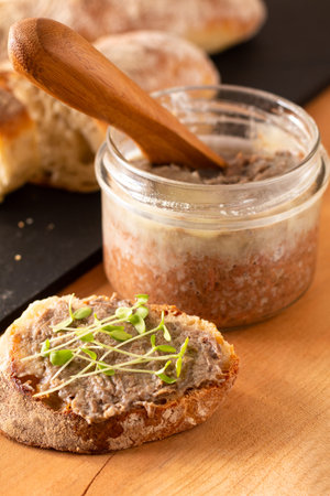 Food Concept french beefs Rillettes  spread on homemade crusty artisan ciabatta bread with flax...
