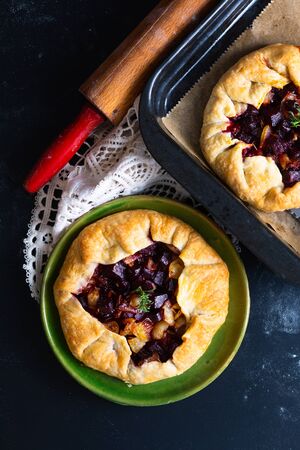 Healthy food concept Homemade rustic organic roasted beets and caramel galette pie with copy spaceの写真素材