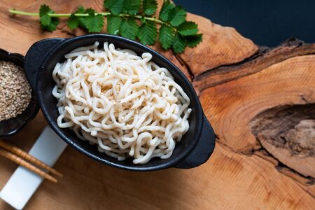 Healthy food concept organic Noodle or spaghetti Shirataki Konjac in black ceramic cup with copy spaceの写真素材
