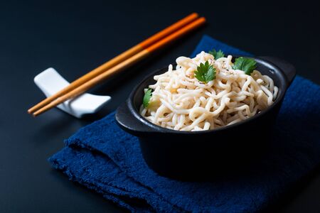 Healthy food concept organic Noodle or spaghetti Shirataki Konjac in black ceramic cup with copy spaceの写真素材