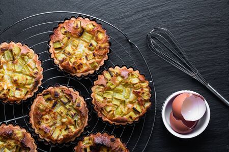 Home cooking concept top view Homemade organic Rhubarb pie on black slate stone boardの写真素材