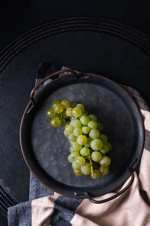 Still life fruit concept grape in vintage iron tray with copy spaceの写真素材