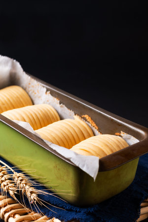 Food concept spot focus dough of Homemade organic Wool soft milk bread on black background with copy...