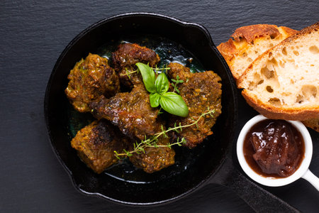 Food concept homemade spot focus roasted grilled satay beefs in skillet iron pan with copy space