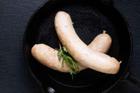 Food concept White sausages on black background with copy spaceの写真素材