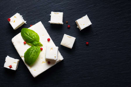 Food concept Organic Feta Cheese on black slate stone board with copy spaceの写真素材