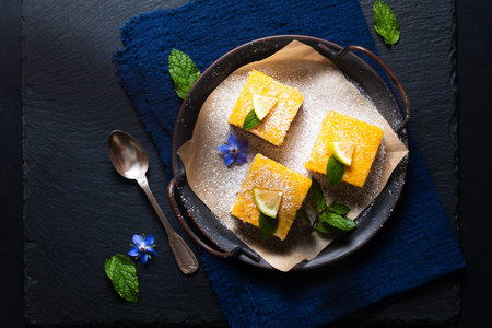 Food concept Homemade rustic Lemon bar pie on black background with copy space