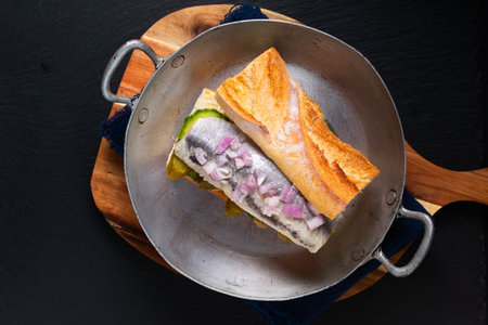 Food Concept herring sandwich on black background with copy spaceの写真素材