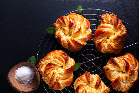 Food concept Homemade inside out hong kong coconut bun on black background with copy spaceの写真素材