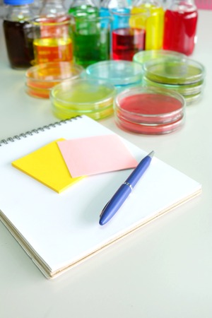 Colorful fluid in petridish for laboratory use on table in laboratoryの写真素材