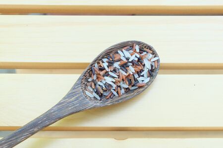 mix of rice on spoonの写真素材