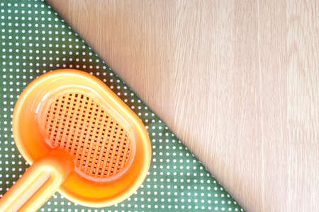 plastic spoon on wooden and dot cloth backgroundの写真素材