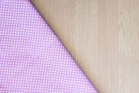 dot cloth on wooden tableの写真素材