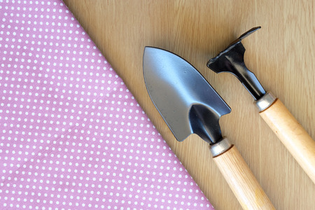 spade on wooden and dot cloth backgroundの写真素材
