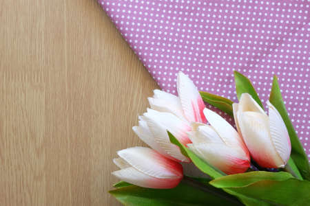 flower on wooden and dot cloth backgroundの写真素材