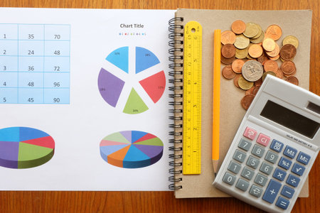chart and money on wooden background with business concept
