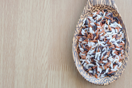 mix of rice on wooden background with healthy conceptの写真素材