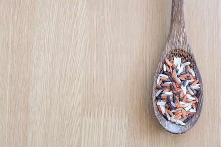 mix of rice on wooden background with healthy concept