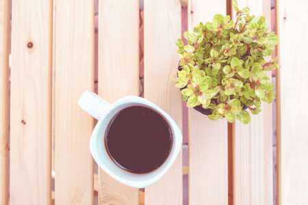 black coffee cup on wooden table