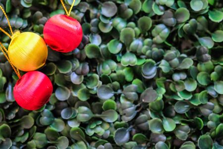 Christmas and new year concept with decorations on green grass backgroundの写真素材