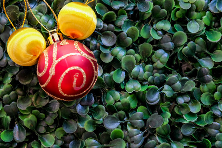 Christmas and new year concept with decorations on green grass backgroundの写真素材