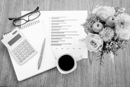 book and graph on wooden with black and white colorの写真素材