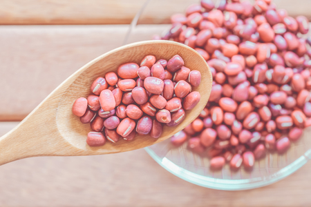 red bean on wooden background with vintage colourの写真素材