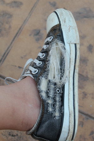 A ripped shoeの写真素材