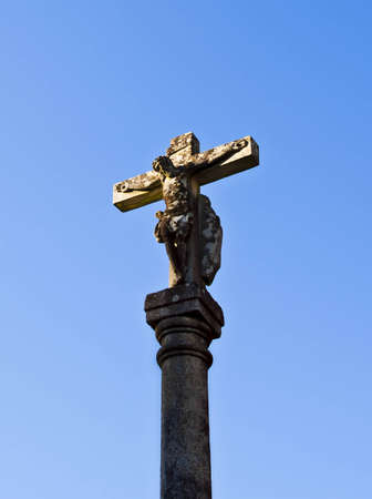 Stone cross with the sky backgroundの写真素材