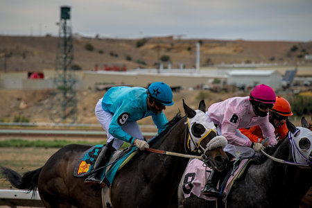 Farmington, NM - May 29 2021: Jockeys running horses at Sunray racetrack and casino trying to win 6...