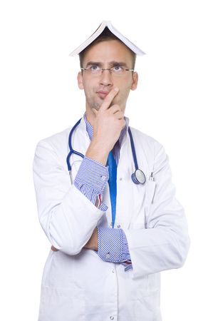 concerned male doctor with book on his headの写真素材