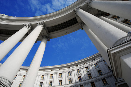 Perspective look on monumental colums and blue sky