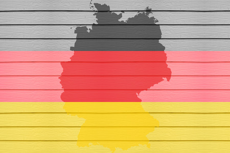 Flag and map of Germany on horizontal wood background.の写真素材