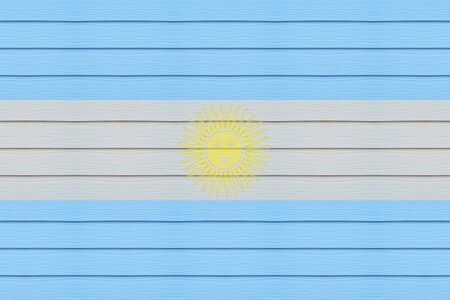 Argentina flag on wood texture background. の写真素材