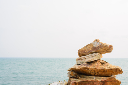 Stack of round smooth stones on a seashore. Business teamwork concepts.の写真素材