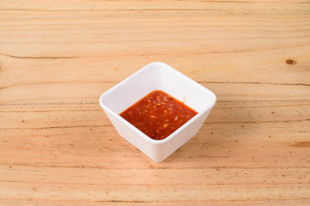 Thai spicy seafood dipping sauce on wooden background.の写真素材