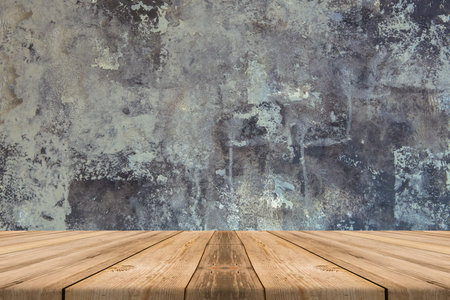 Empty Wooden Table top at concrete wall - can be used for display or montage or mock up your...