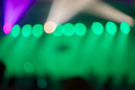 Blurred background, Bokeh lighting in concert with audience, Music showbiz concept, vintage filtered image.の写真素材
