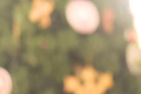 Festive Christmas background of defocused decorated xmas tree bokeh compositionの写真素材